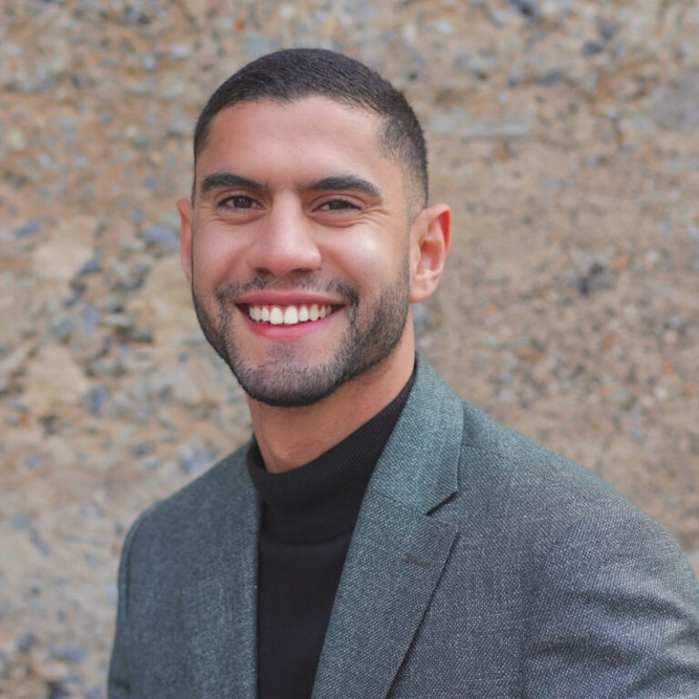 Portrait of Amine Gabbouj, Program Manager at the IGLTA Foundation.